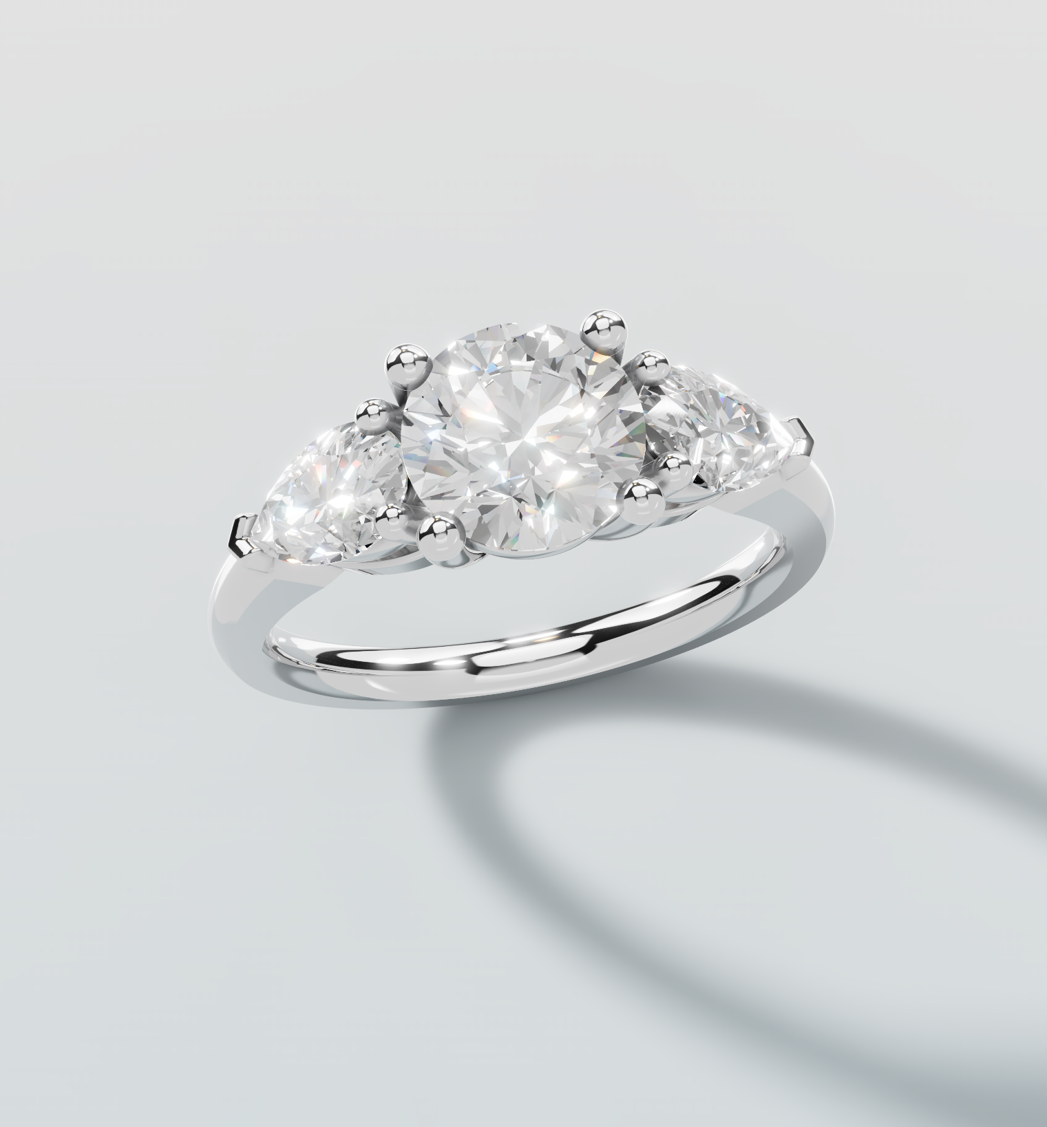 Silver ring with a large diamond and smaller stones on a light gray background